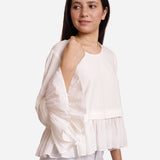 Right Detail of a Model wearing White Frilled Cotton Peplum Top