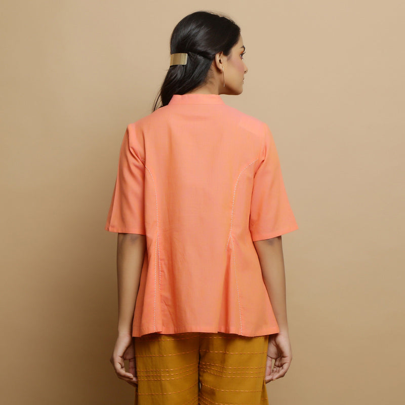 Back View of a Model wearing Handwoven Cotton Godet Button-Down Top