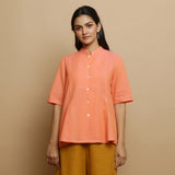 Front View of a Model wearing Handwoven Cotton Godet Button-Down Top