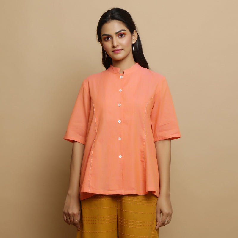 Front View of a Model wearing Handwoven Cotton Godet Button-Down Top