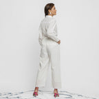 Back View of a Model wearing Crisp White Organic Cotton Top and Pant Set