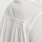 Back Detail of a Model wearing White Cotton Lined Button-Down Top