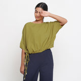 Front View of a Model wearing Solid Green Cotton Flax Blouson Top
