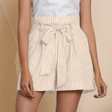 Front Detail of a Model wearing Cotton Beige Striped Paperbag Shorts