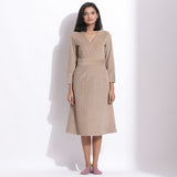 Front View of a Model wearing Cotton Corduroy Taupe Beige Surplice Dress