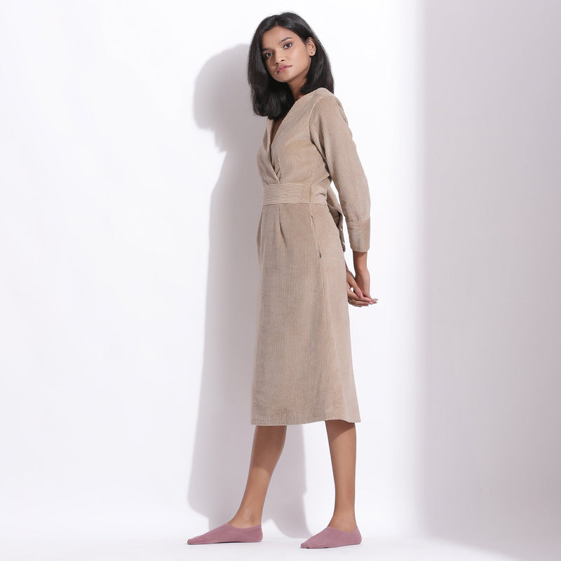 Left View of a Model wearing Cotton Corduroy Taupe Beige Surplice Dress