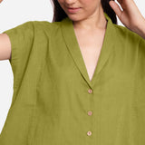 Front Detail of a Model wearing Green Deep Neck Button-Down Cotton Top