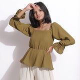 Front View of a Model wearing Cotton Waffle Olive Green Peplum Top