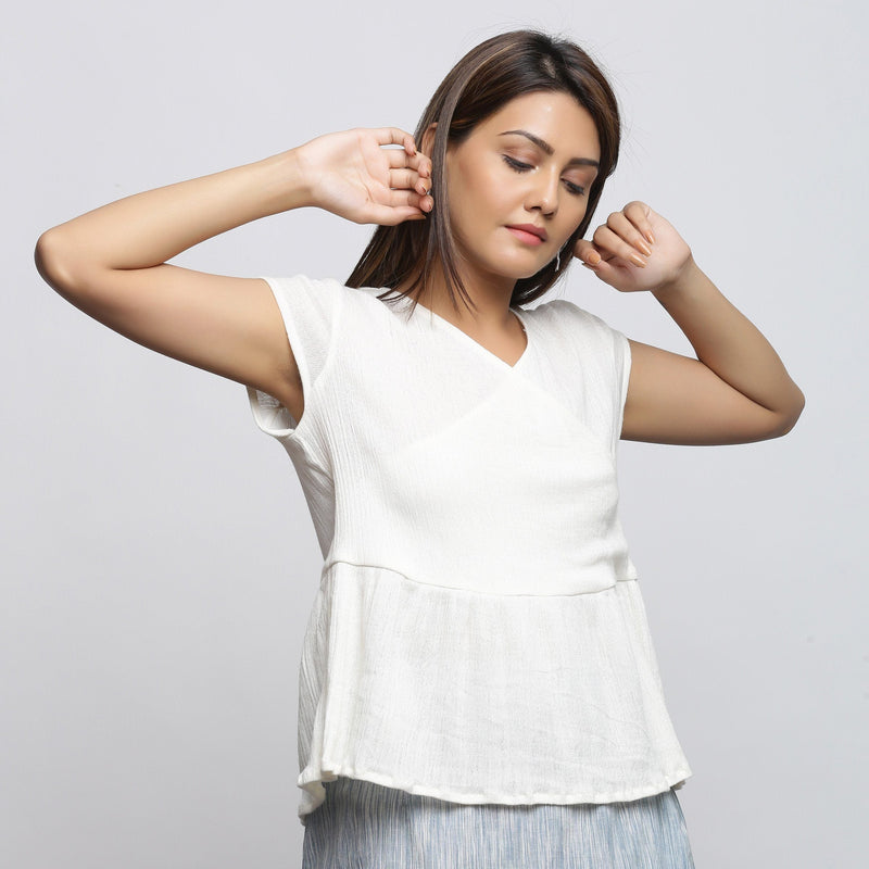 Front View of a Model wearing Off-White Crinkled Cotton Wrap Top