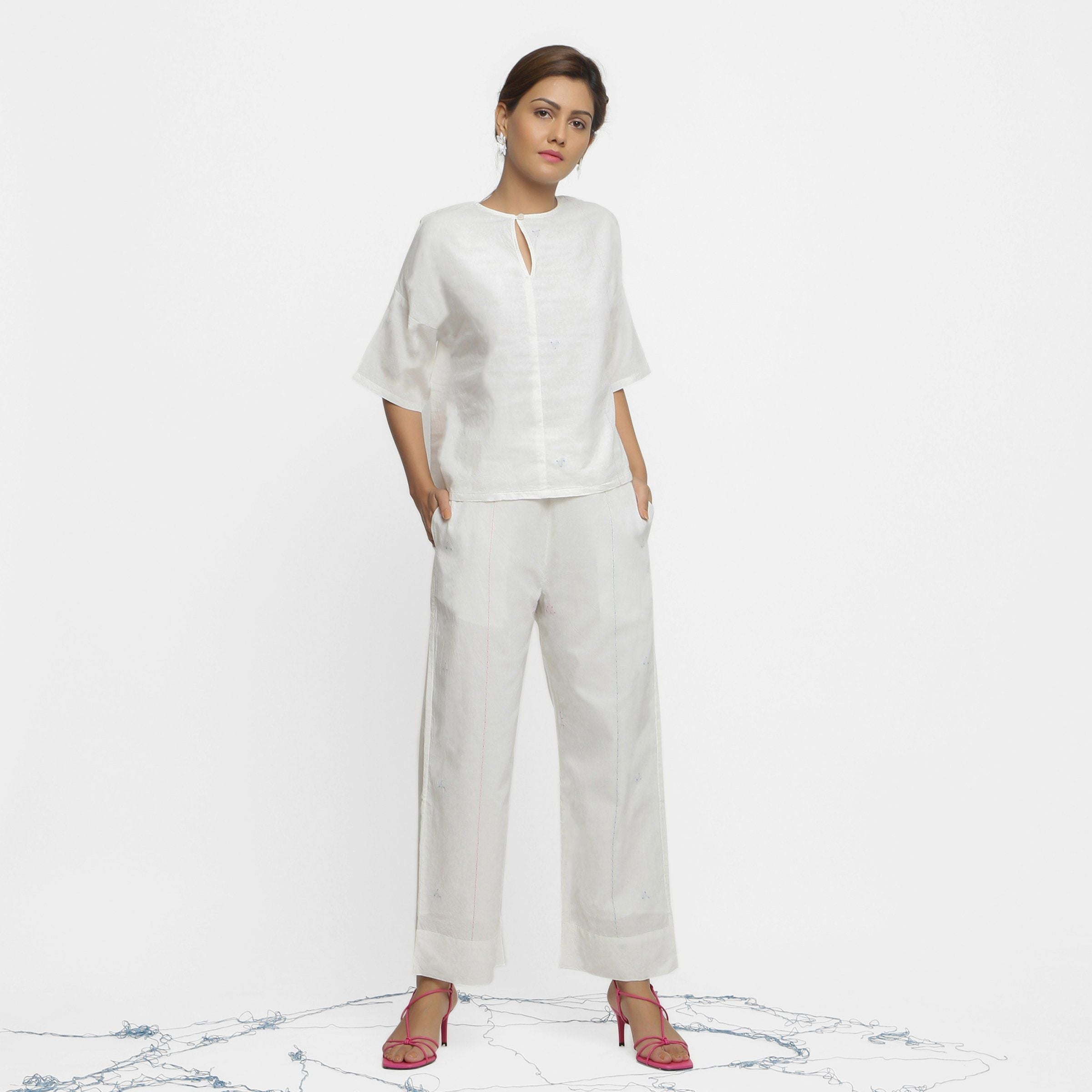 Front View of a Model wearing Off-White Hand Embroidered Top and Pant Set