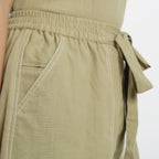 Right Detail of a Model wearing Khaki Vegetable Dyed Handspun Short Shorts