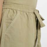 Right Detail of a Model wearing Khaki Vegetable Dyed Handspun Short Shorts