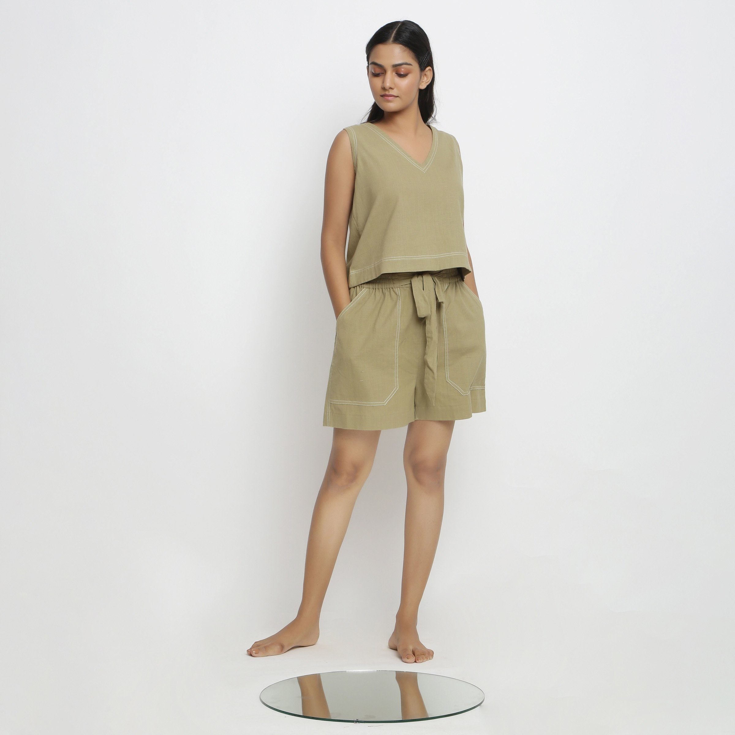 Front View of a Model wearing Crisp Khaki Green Top and Handspun Shorts Set
