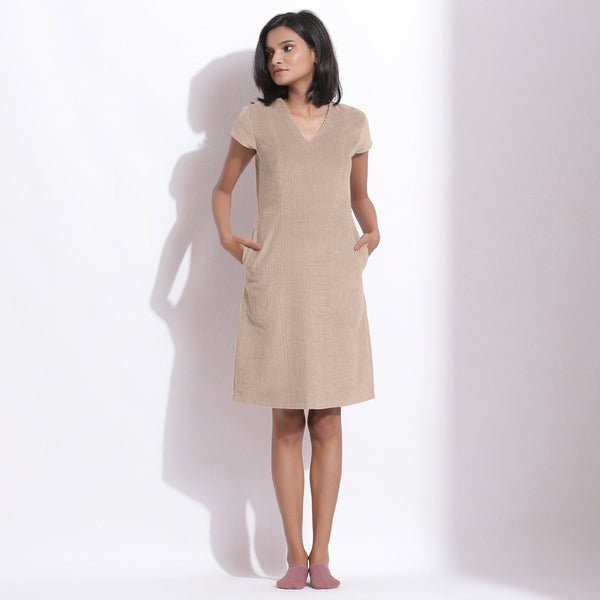 Front View of a Model wearing Dusk Beige Cotton Corduroy V-Neck Dress