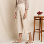 Left View of a Model wearing Dusk Beige Cotton Striped Elasticated Pant
