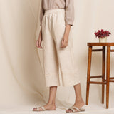 Left View of a Model wearing Dusk Beige Cotton Striped Elasticated Pant