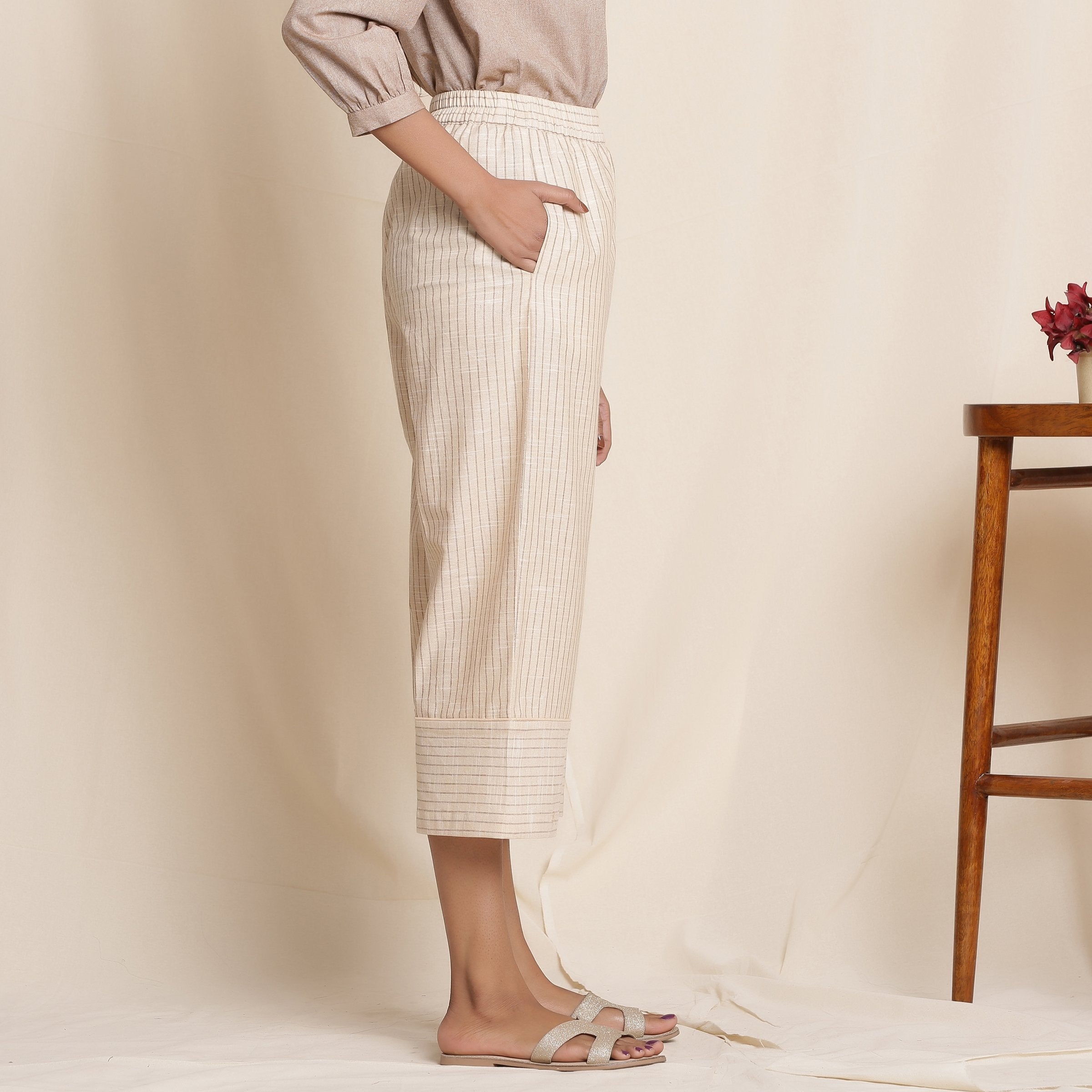 Right View of a Model wearing Dusk Beige Cotton Striped Elasticated Pant