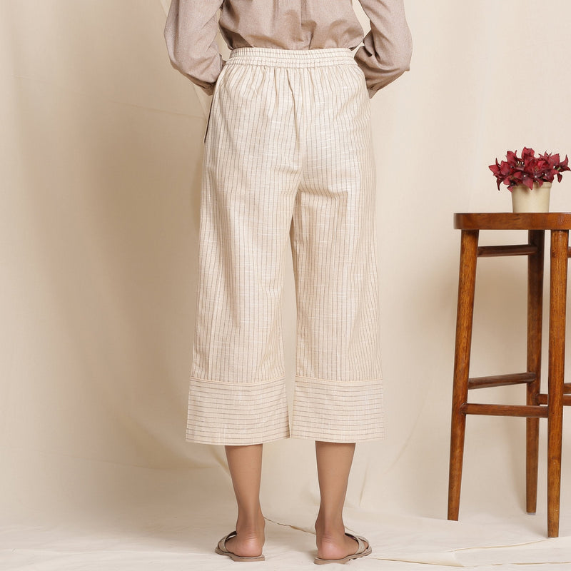 Back View of a Model wearing Dusk Beige Cotton Striped Elasticated Pant