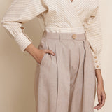 Front Detail of a Model wearing Dusk Brown Box Pleated Pegged Pant