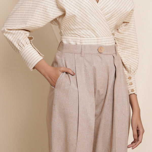 Front Detail of a Model wearing Dusk Brown Box Pleated Pegged Pant