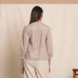 Back View of a Model wearing Dusk Brown Straight Gathered Top