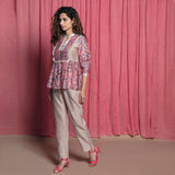 Left View of a Model wearing Dust Pink Chanderi Block Print Frilled Yoked Top