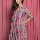 Front Detail of a Model wearing Dust Pink Floral Chanderi Block Print Tier Dress