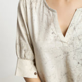 Front Detail of a Model wearing Beige Dabu Printed Deep Neck A-Line Top