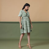 Right View of a Model wearing Fern Green Shibori Drop Shoulder Dress