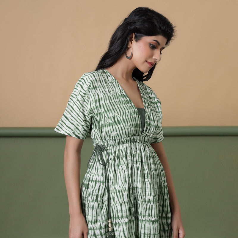 Right View of a Model wearing Fern Green Shibori Drop Shoulder Dress