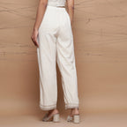 Back View of a Model wearing Jute Cotton Lace Straight Pant
