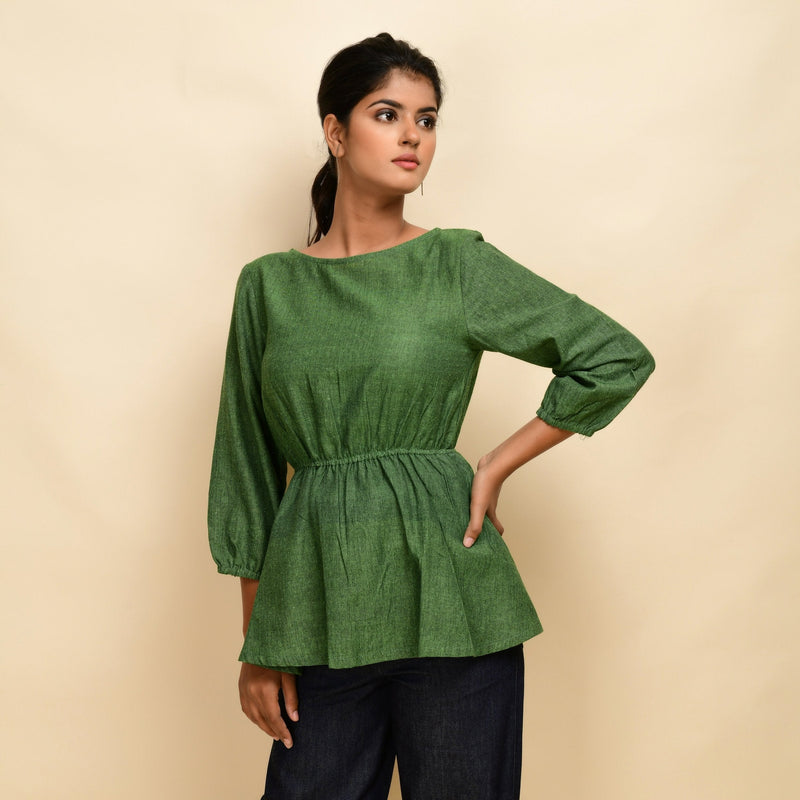 Front View of a Model wearing Forest Green 100% Cotton Round Neck Peplum Top