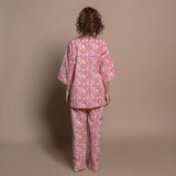 Back View of a Model wearing Fuchsia Floral Block Print Cotton Tunic Top