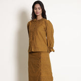 Front View of a Model wearing Golden Oak Frilled Sleeve Button Down Top