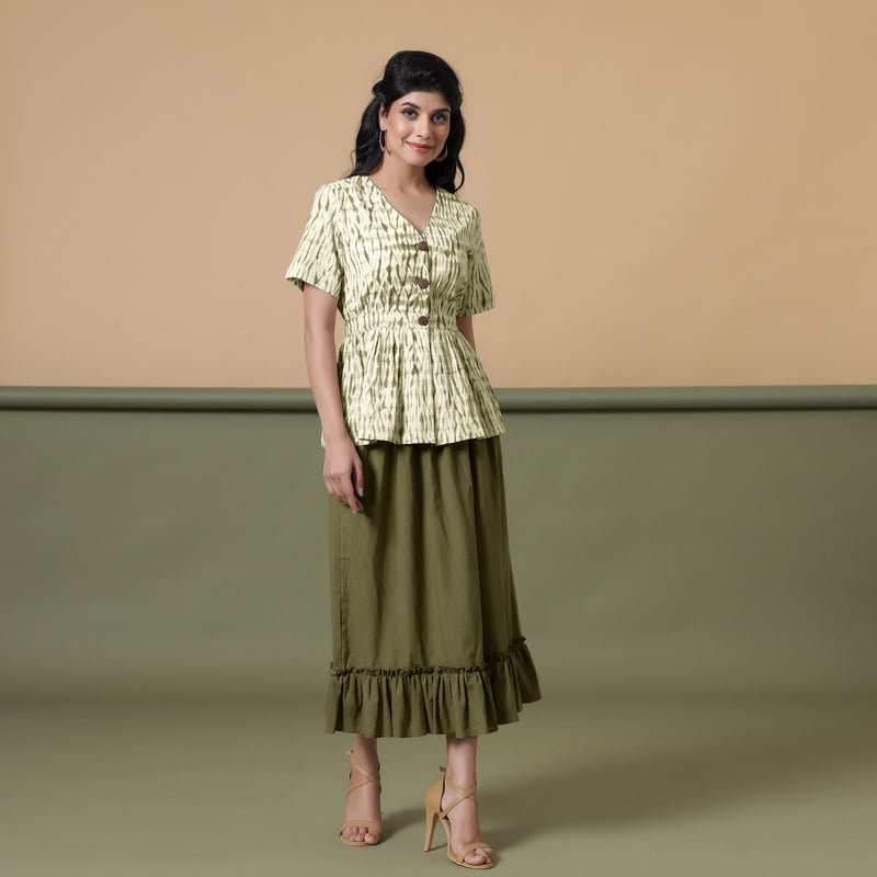 Front View of a Model wearing Green Peplum Top and Olive Green Skirt Set
