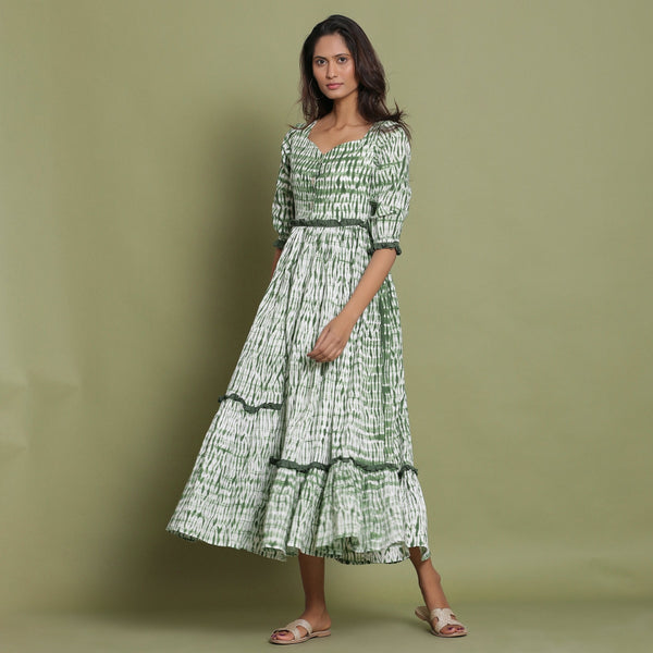 Front View of a Model wearing Green Shibori Asymmetrical Tier Maxi Dress