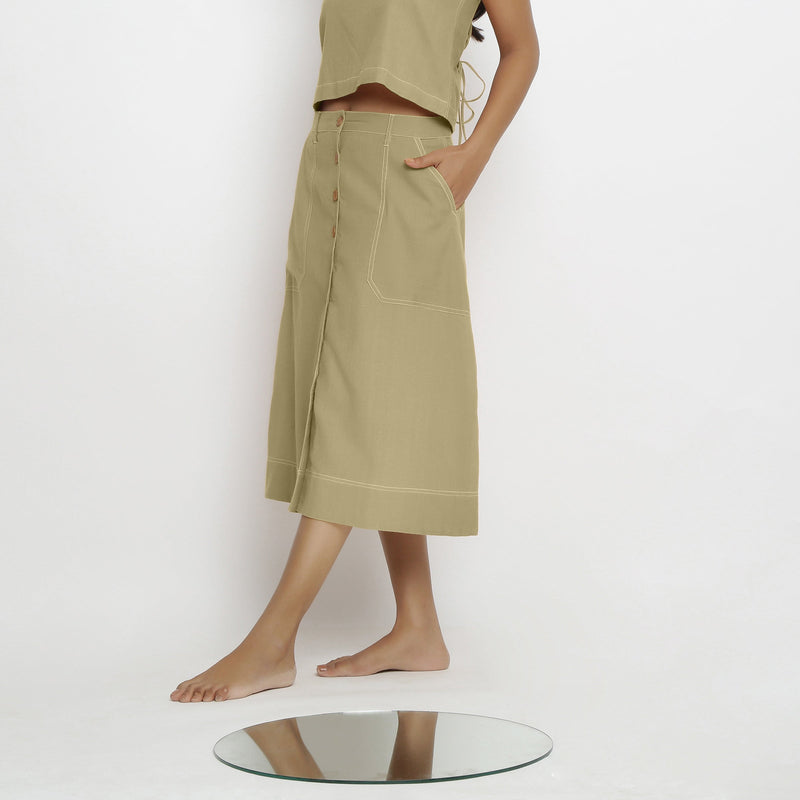 Left View of a Model wearing Khaki Green Vegetable Dyed Button-Down Skirt