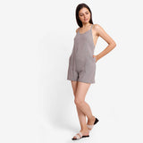 Left View of a Model wearing Grey Criss-Cross Back Paneled Romper