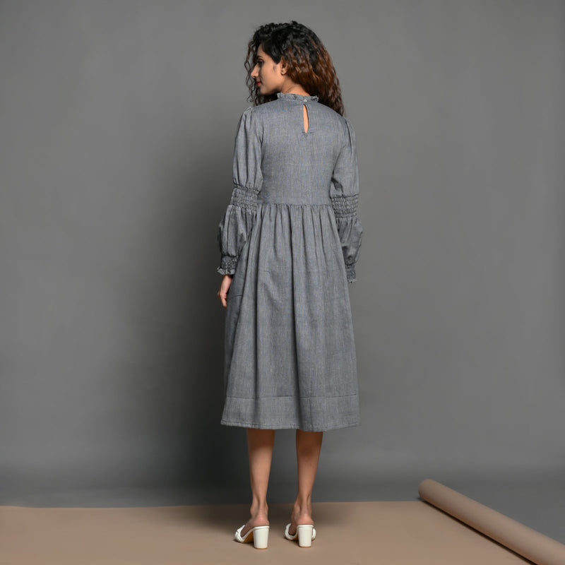 Back View of a Model wearing Grey Handspun Cotton Frilled Peasant Dress