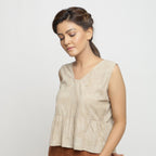 Left View of a Model wearing Beige Dabu Printed Sleeveless Gathered Top