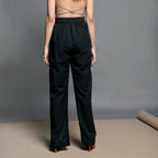 Back View of a Model wearing Black Handspun Cotton High Rise Slit Pants