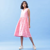 Front View of a Model wearing Handspun Cotton Pink Checks Yoke Dress