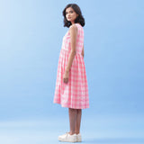 Left View of a Model wearing Handspun Cotton Pink Checks Yoke Dress