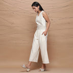Left View of a Model wearing Handspun Ivory Jute Laced Jumpsuit