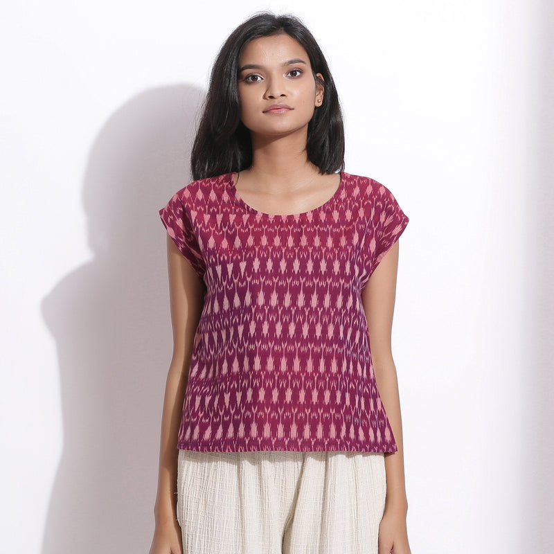 Front View of a Model wearing Handwoven Ikat Berry Wine Straight Top