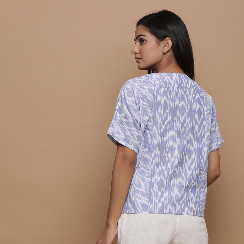 Back View of a Model wearing Ikat Powder Blue Split Neck Top