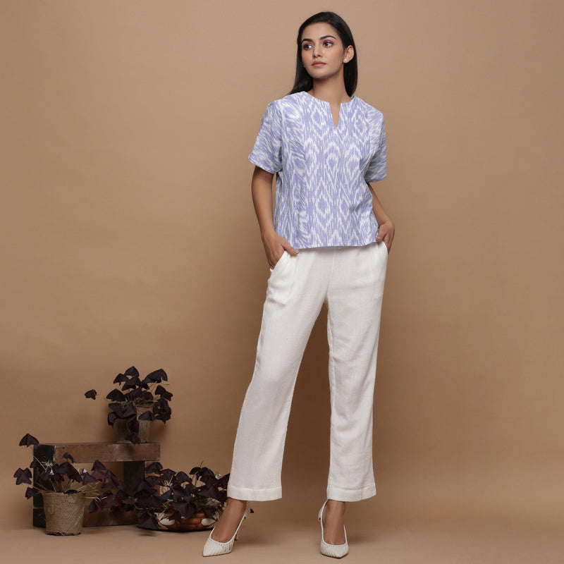 Front View of a Model wearing Ikat Powder Blue Top and Off-White Pant Set