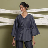 Front View of a Model wearing Indigo Cotton Denim Drop Shoulder Sleeve Overlay