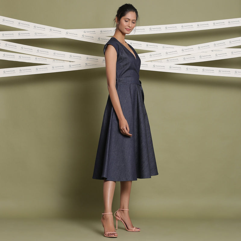 Right View of a Model wearing Indigo Cotton Denim Fit and Flare Dress