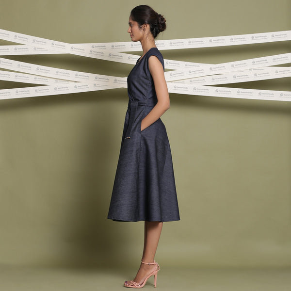 Left View of a Model wearing Indigo Cotton Denim Fit and Flare Dress